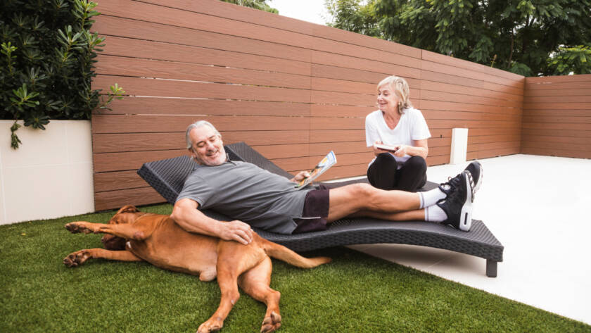 family in backyard with artificial grass