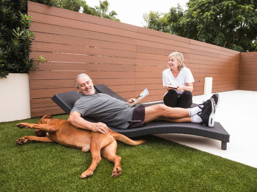 family in backyard with artificial grass